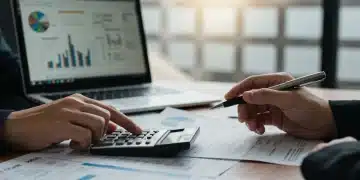 Person calculating 2025 tax deductions with calculator and forms